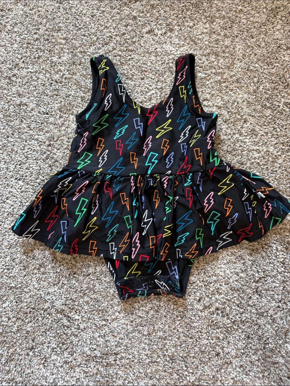 Posh Peanut Black Lightning Bolt Peplum Swimsuit with Multicolor Bolts